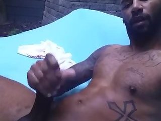 Hot black guy wanks in his backyard.